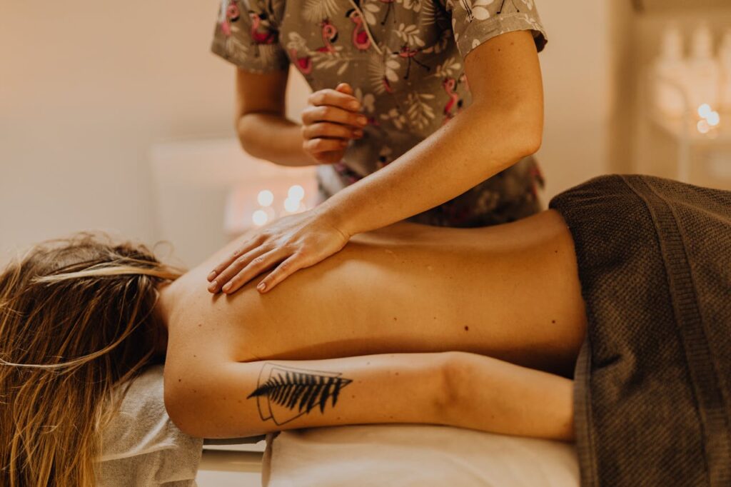 pexels photo 6629539 Woman receiving a relaxing back massage in a cozy spa setting, enhancing wellness and relaxation.